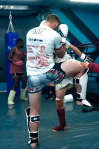 Blocking a roundhouse kick in muaythai